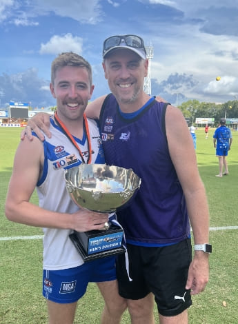 Marcus as a game day runner-physio with player and fellow physiotherapist Brandon Bailey.